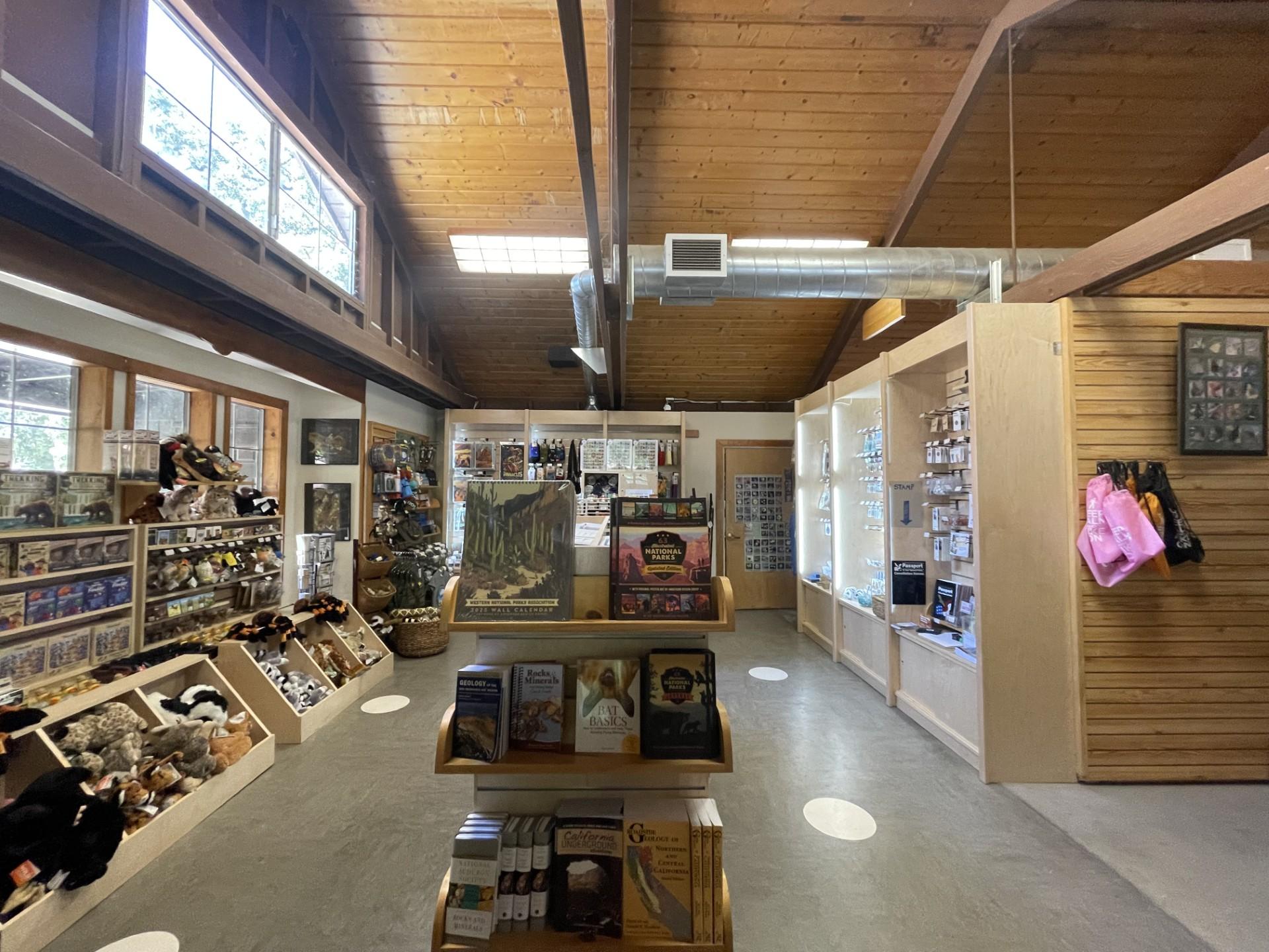 Inside a building that has souvenirs such as games, books, and plush animals
