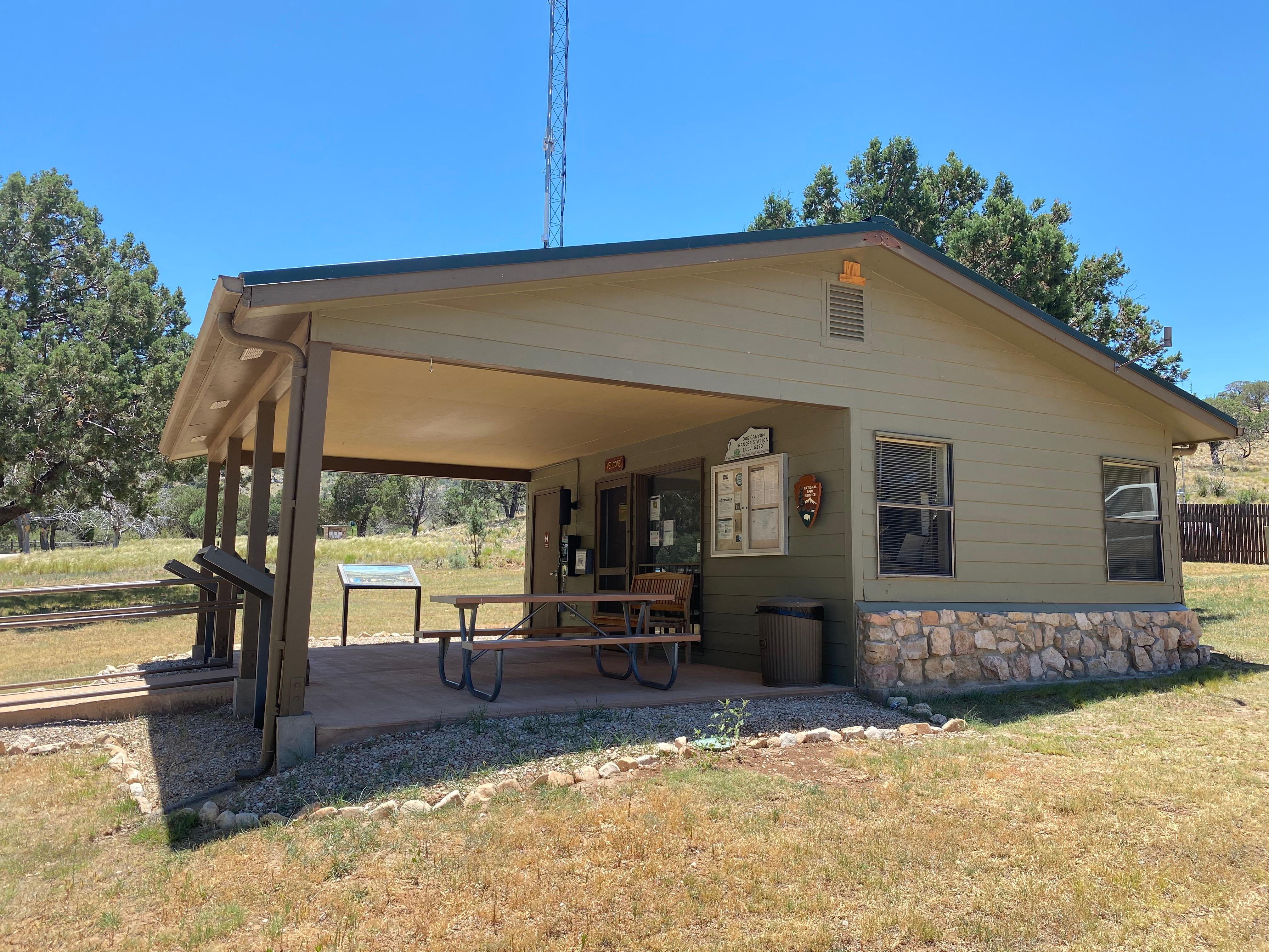 Side view of a small building with a porch
