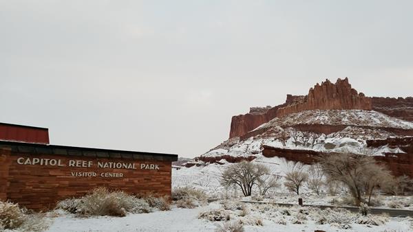 visitor center building with snow on the landscape