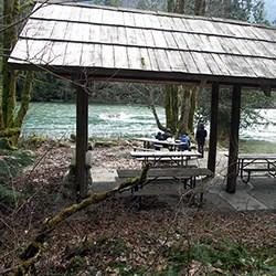 A picnic shelter next to a river