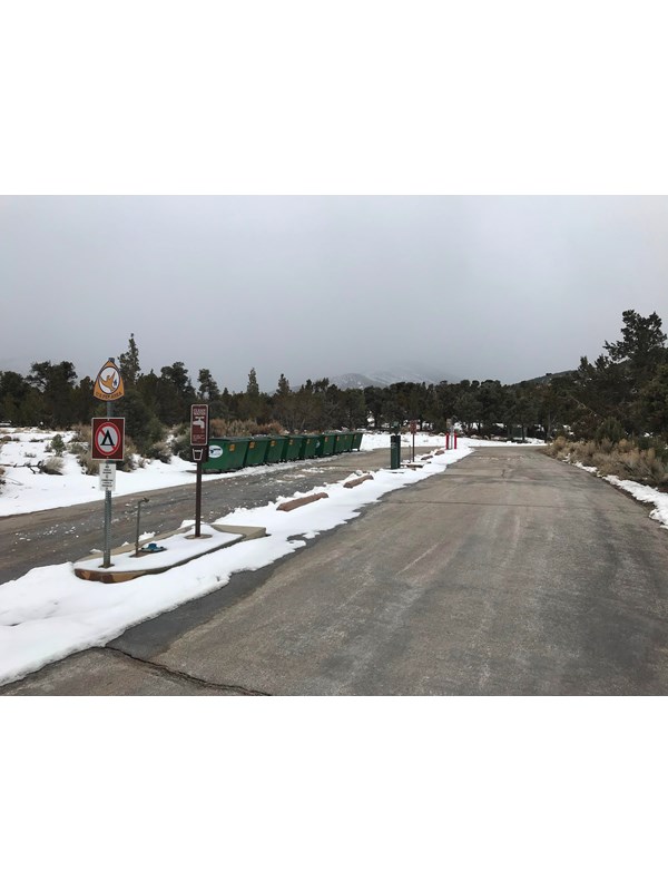 Great Basin Dump Station with sewage hose, water fill up, and dumpsters