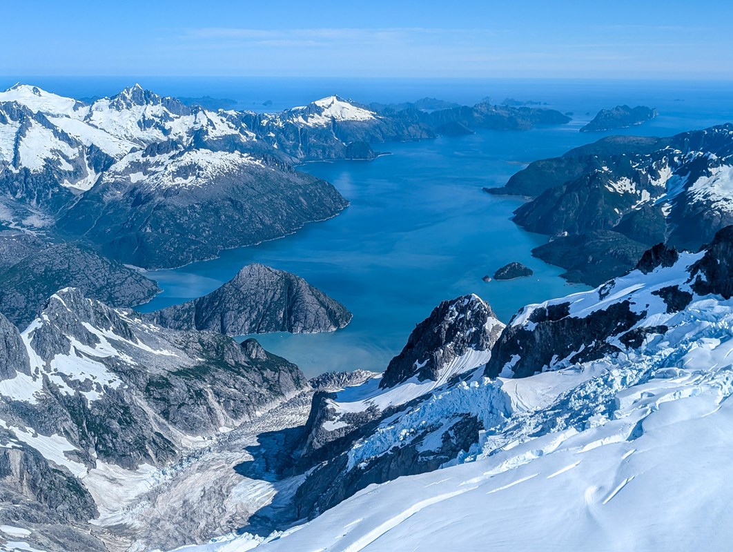 A thin bay surrounded by mountains and ice
