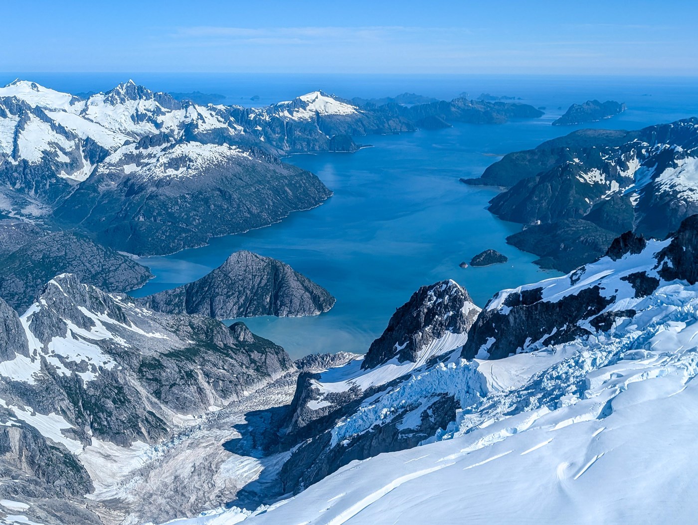 A thin bay surrounded by mountains and ice