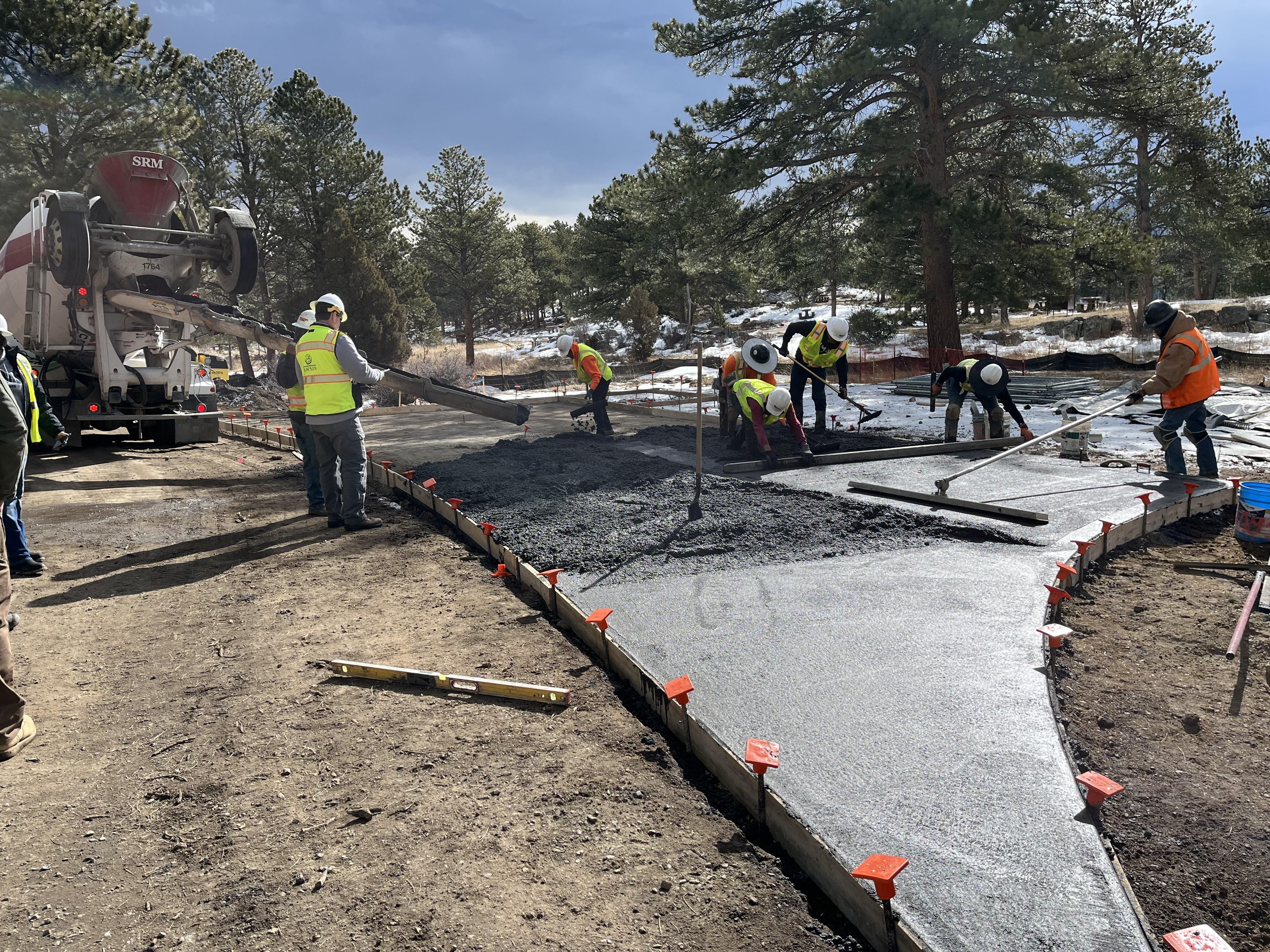 Concrete is being pored and spread smooth for new walkways in Moraine Park Campground