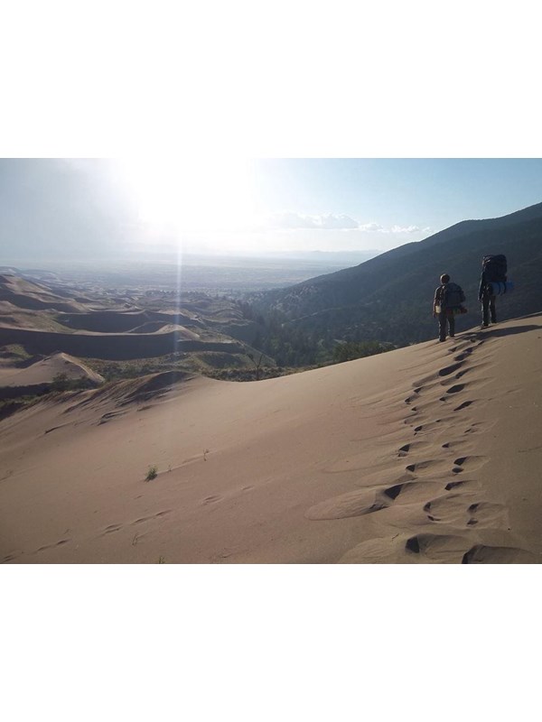 Backpackers walking on eastern side of dunefield