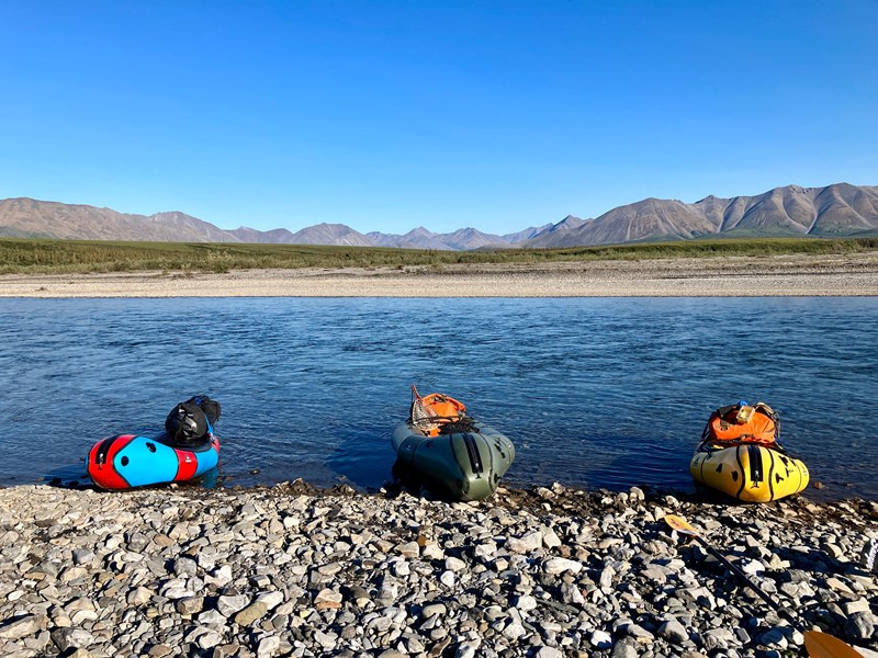Three packrafts Three multicolored packrafts on the gravel shore of the Kelly river