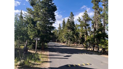 A paved road around Longs Peak Campground to the campsites
