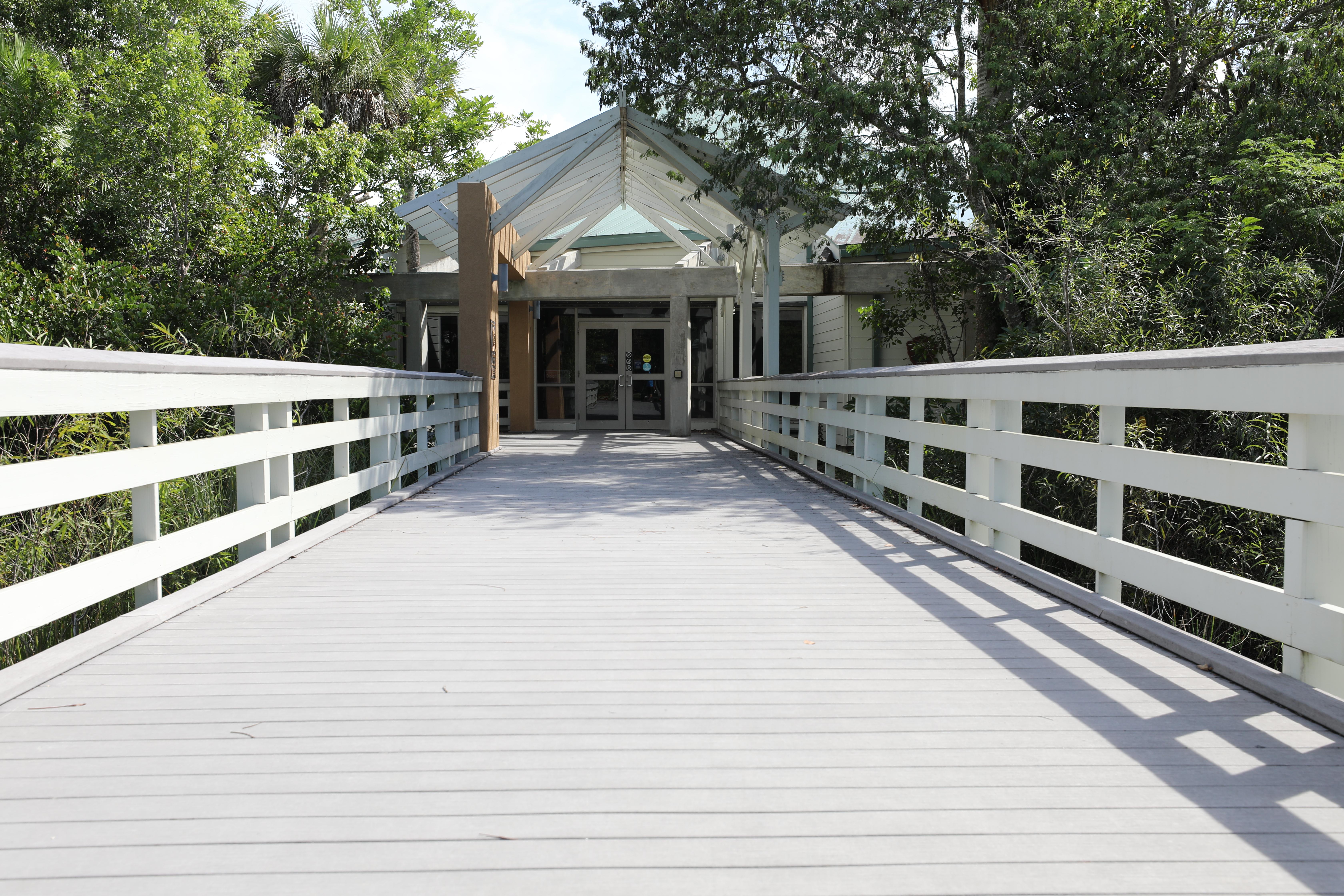 A wide boardwalk with handrails leads to a visitor center