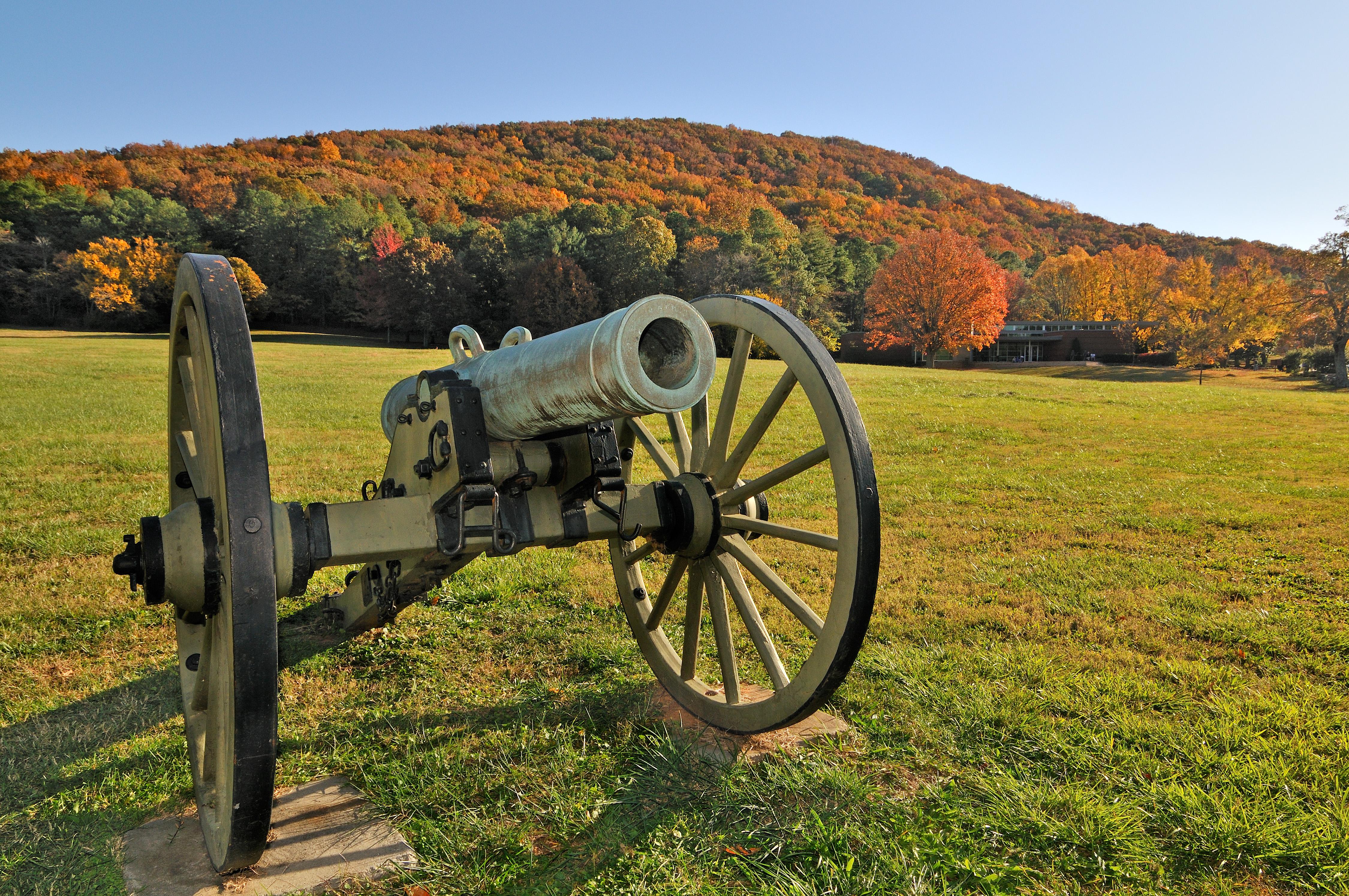Cannon with front field and Visitor Center in background.