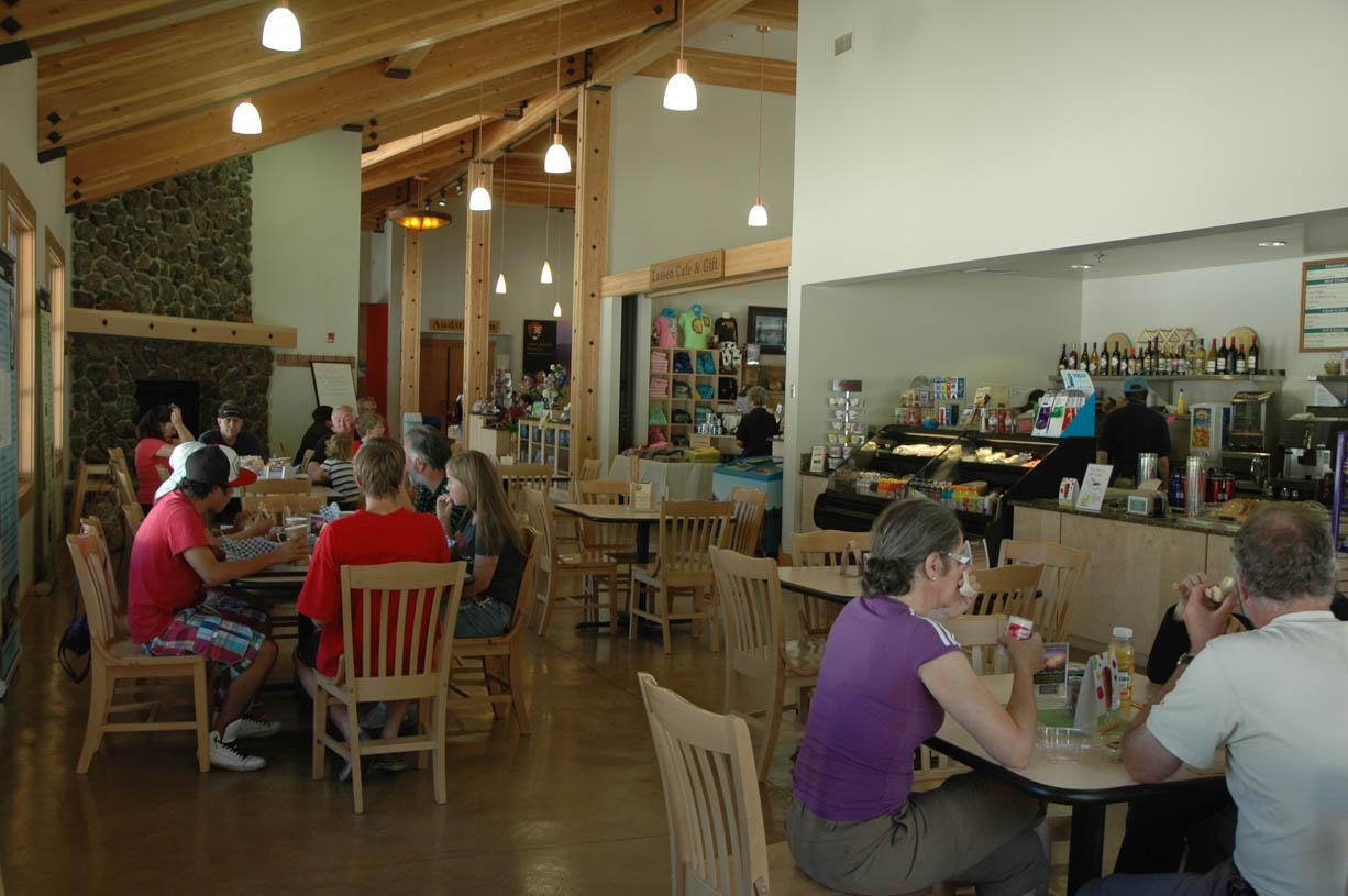 People sitting in a small fireside dining area.