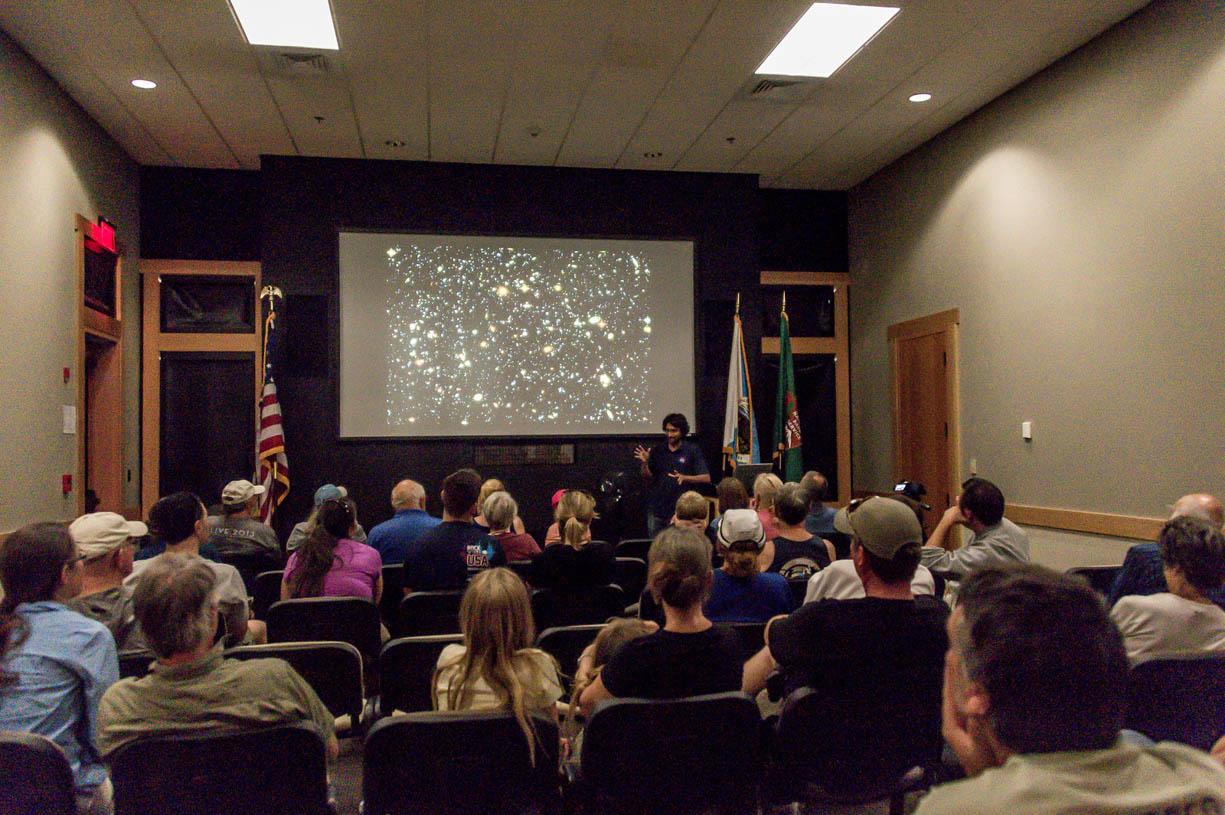 People sitting inside a small auditorium