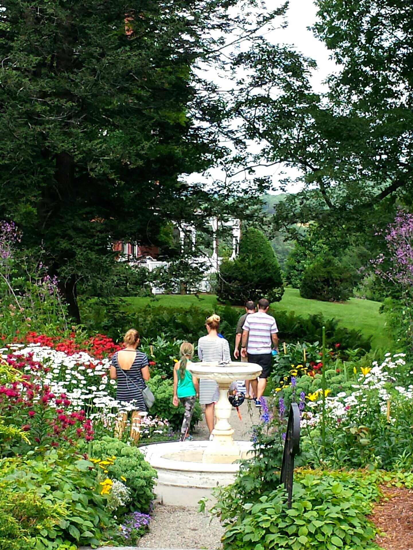 Visitors amongst the blooms in the Mansions formal gardens