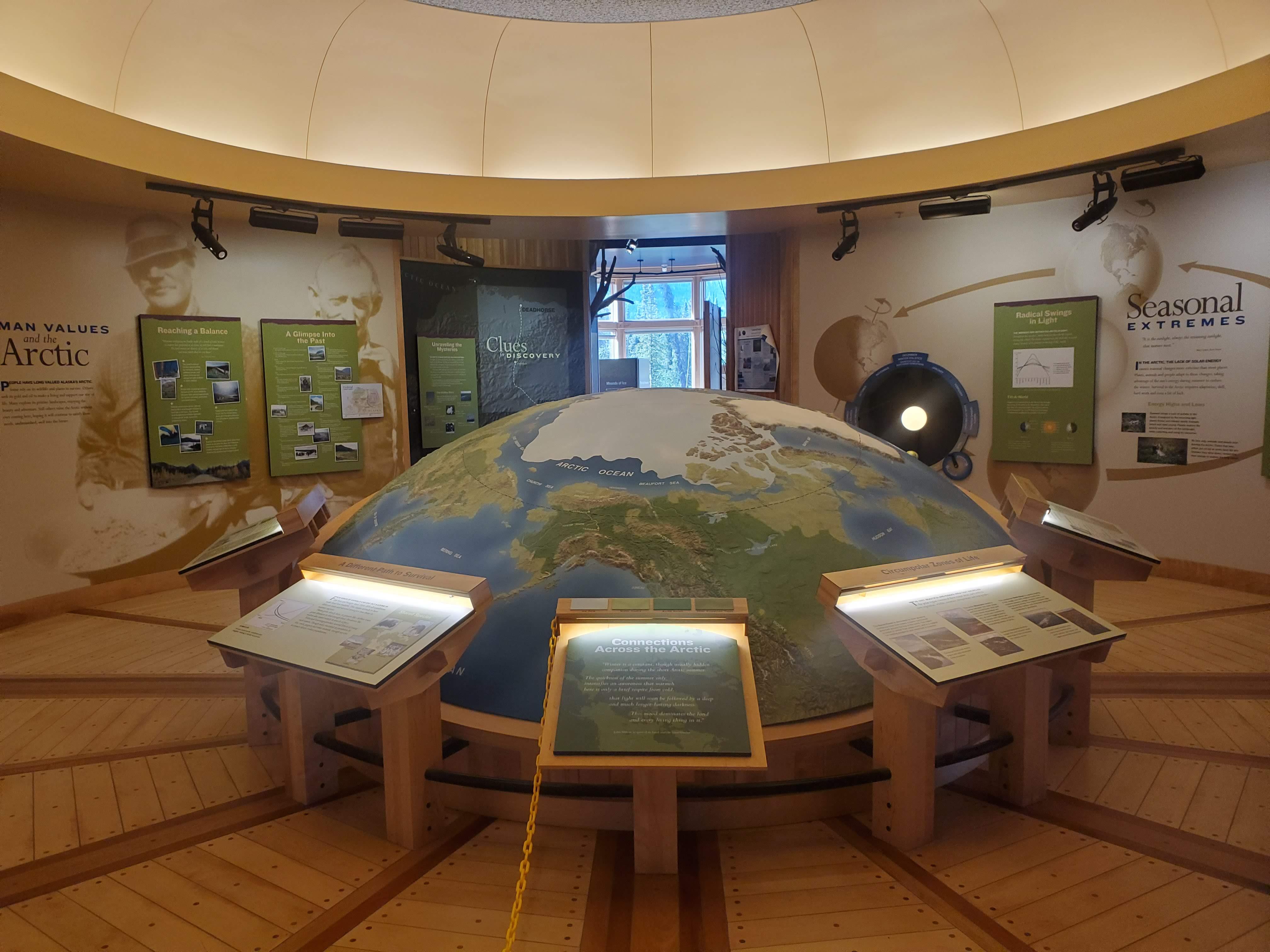 Circular room with large map showing the arctic circle and information panels