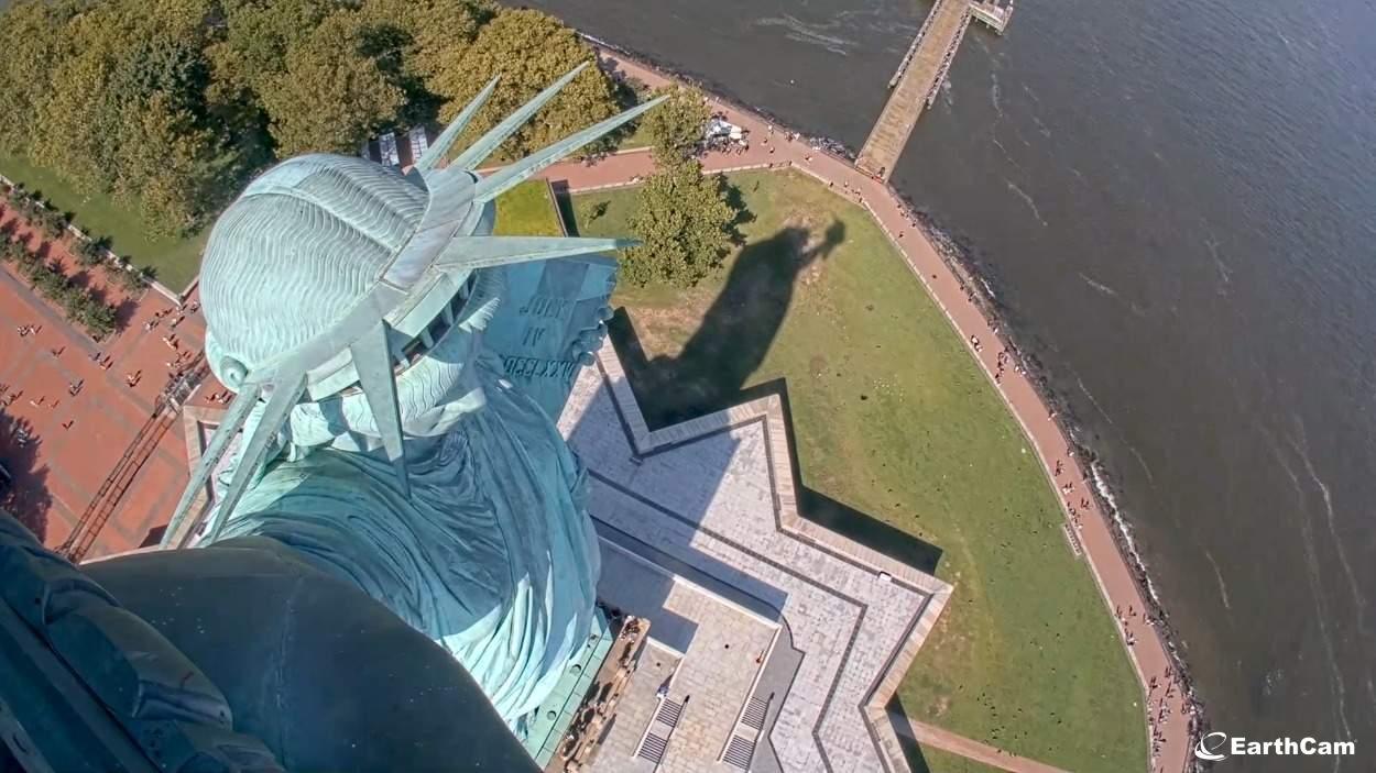 A view of the Statue of Liberty from the torch platform looking down on rest of the statue.