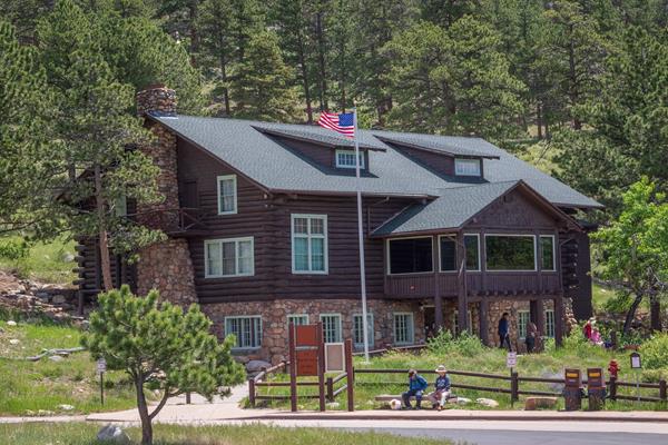 A multi-story log cabin building.