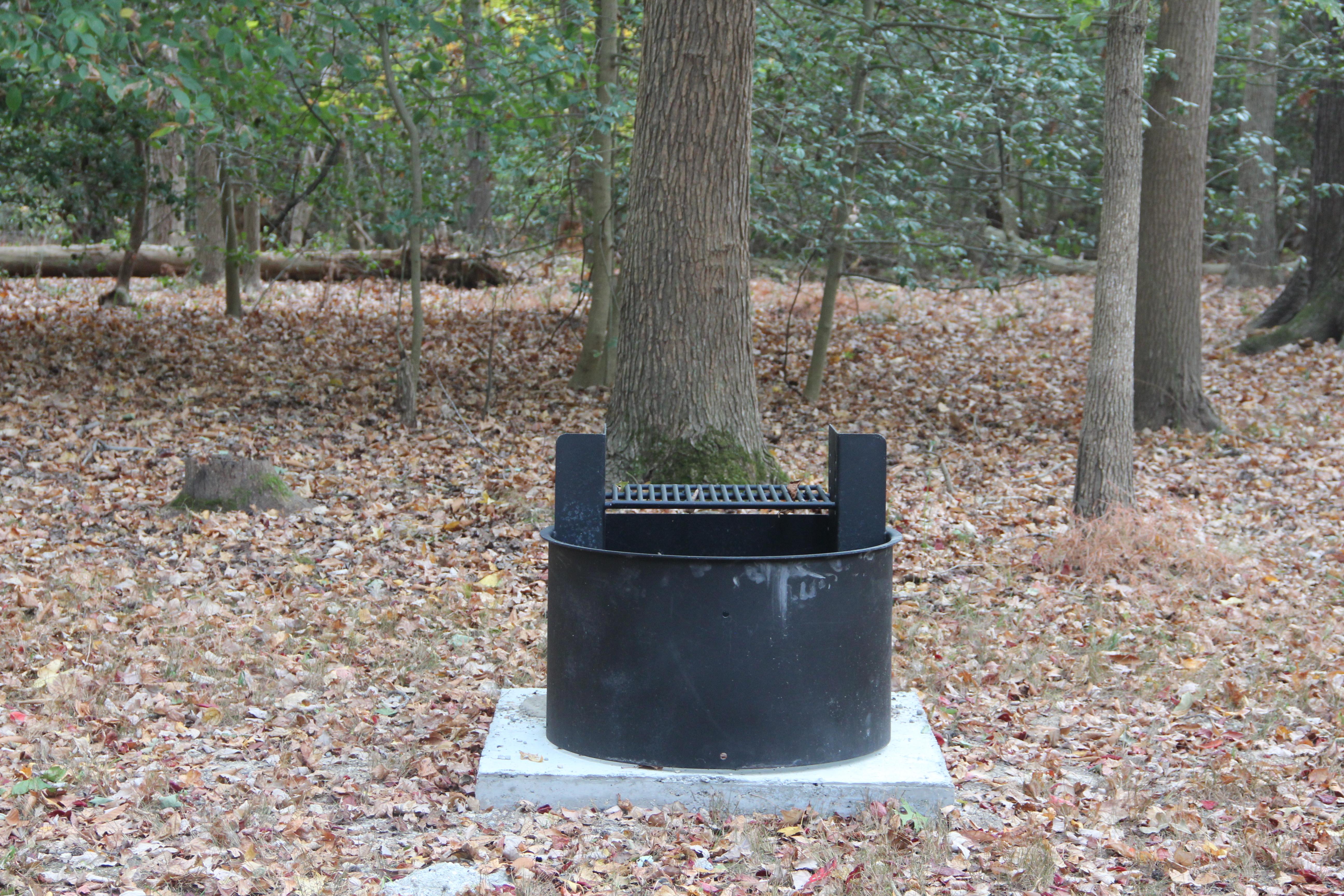 a round back grill with grill on top on a campsite in the Greenbelt Park campground