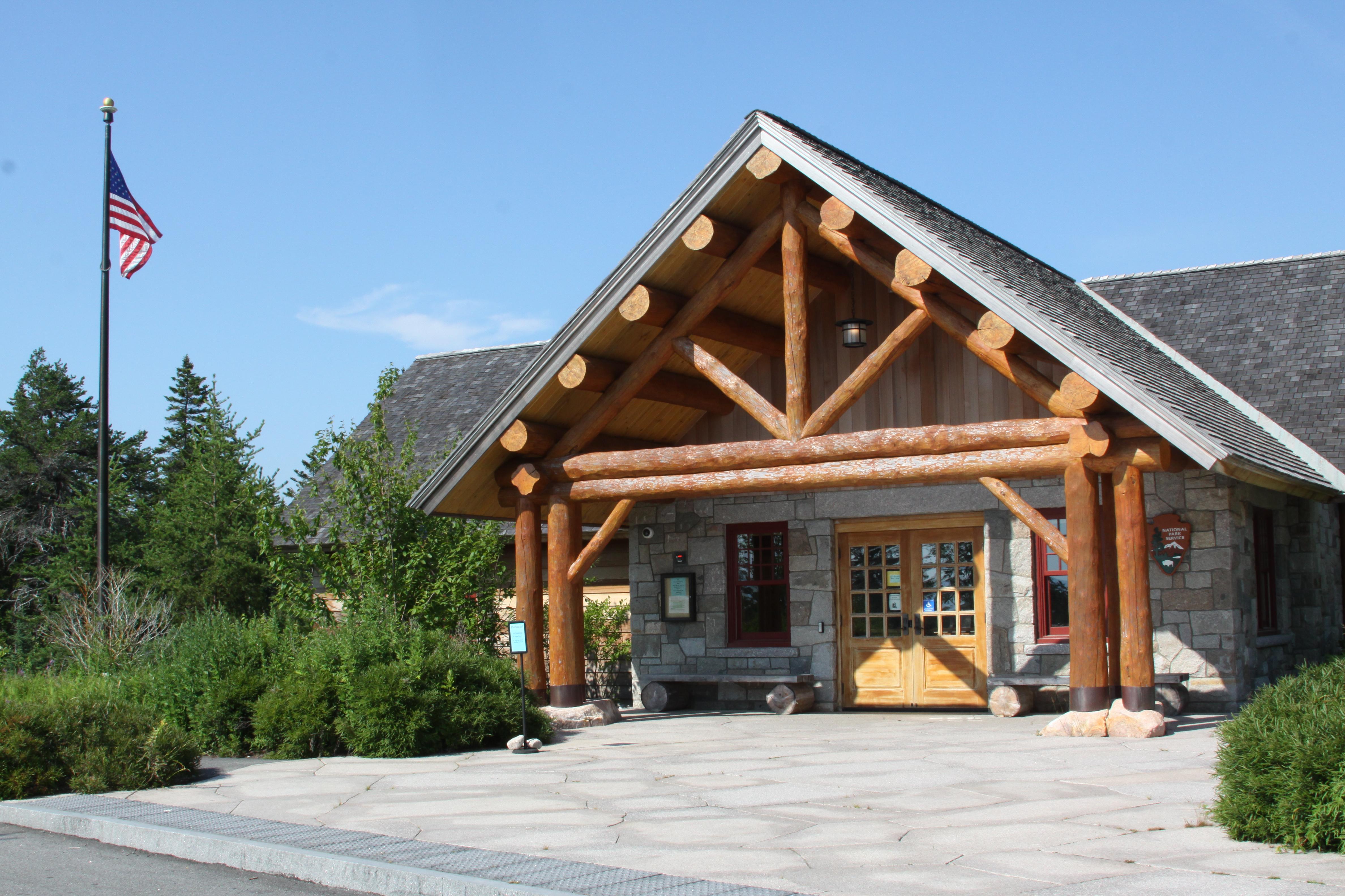 A wooden ranger station building with an A-frame style entrance