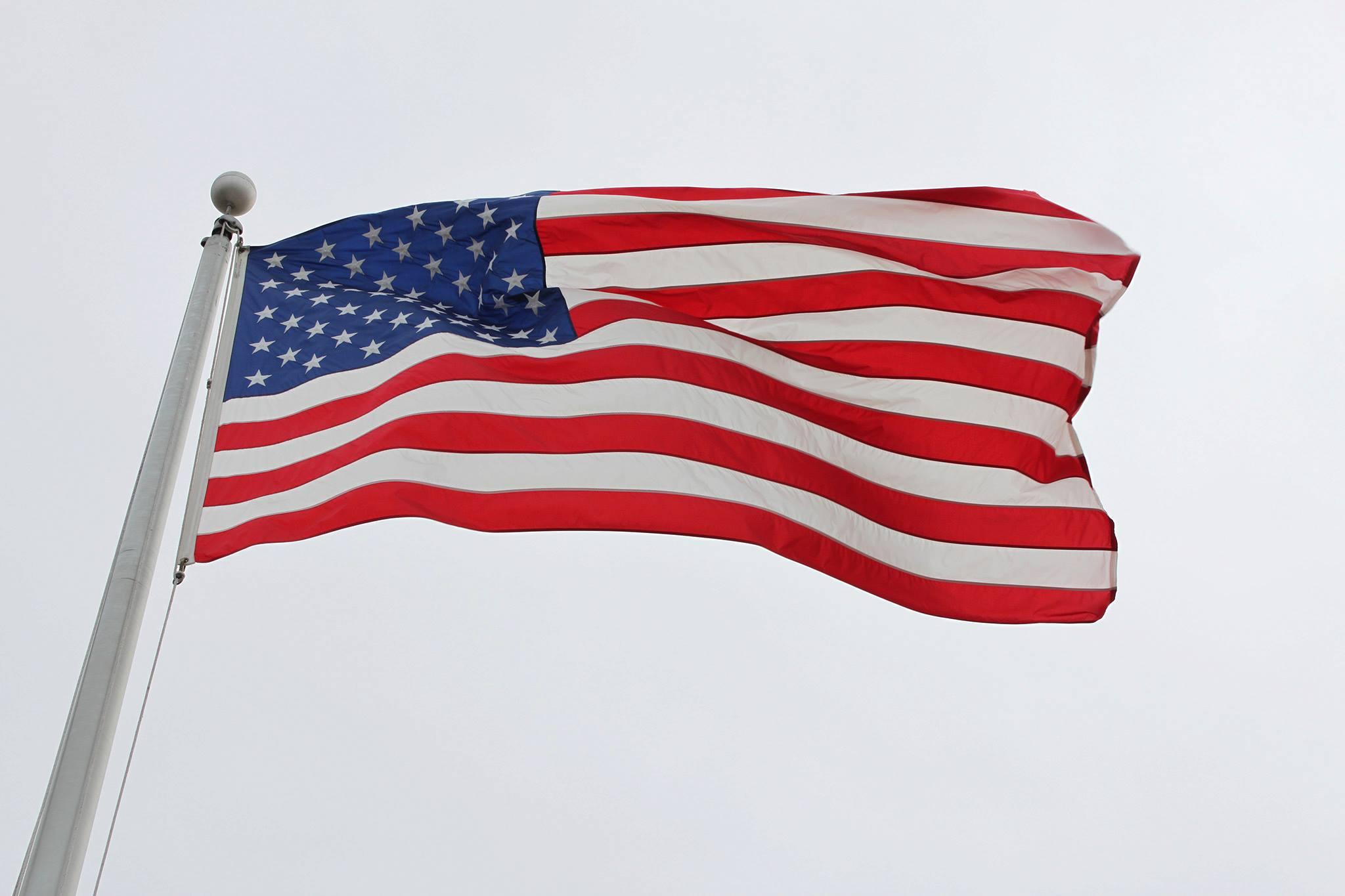 American flag waves in the wind.