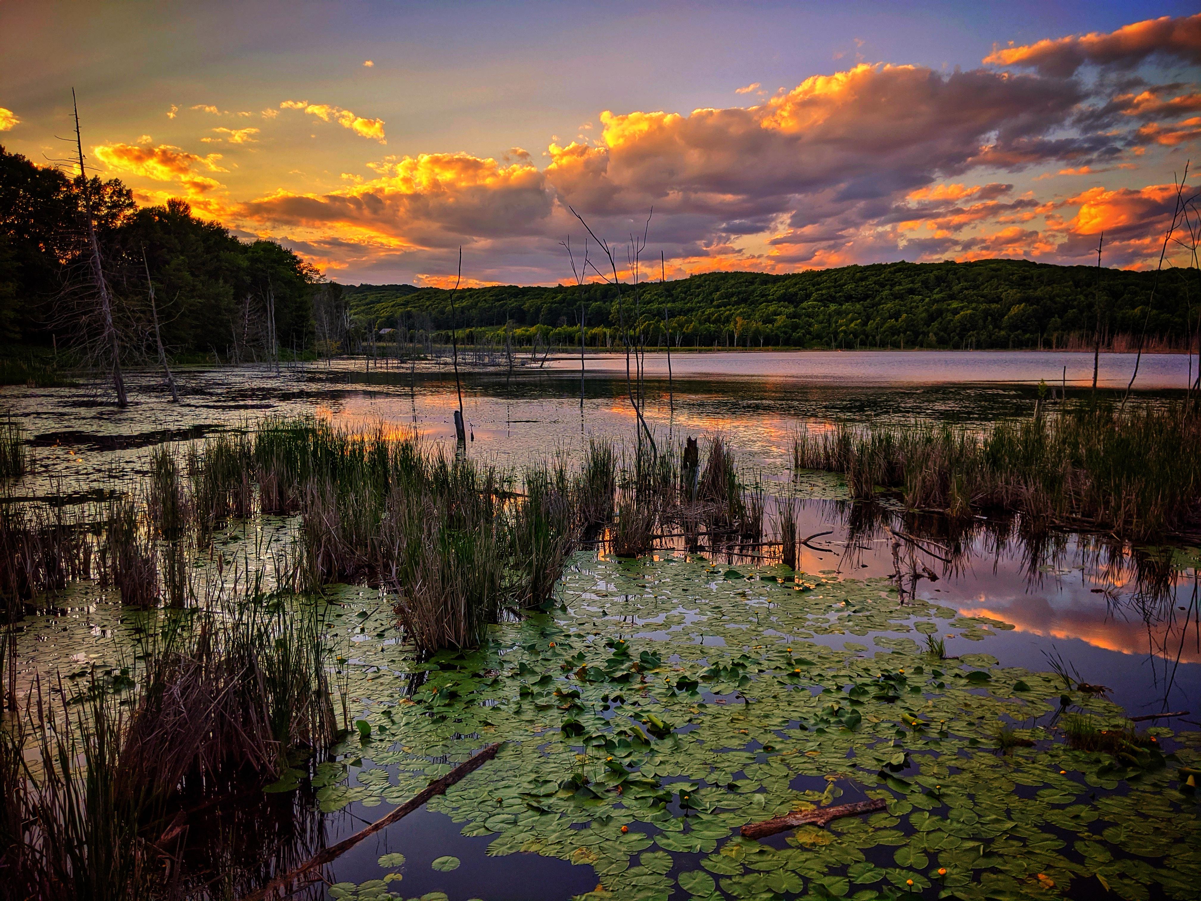 A stunning lake surrounded by the setting sun