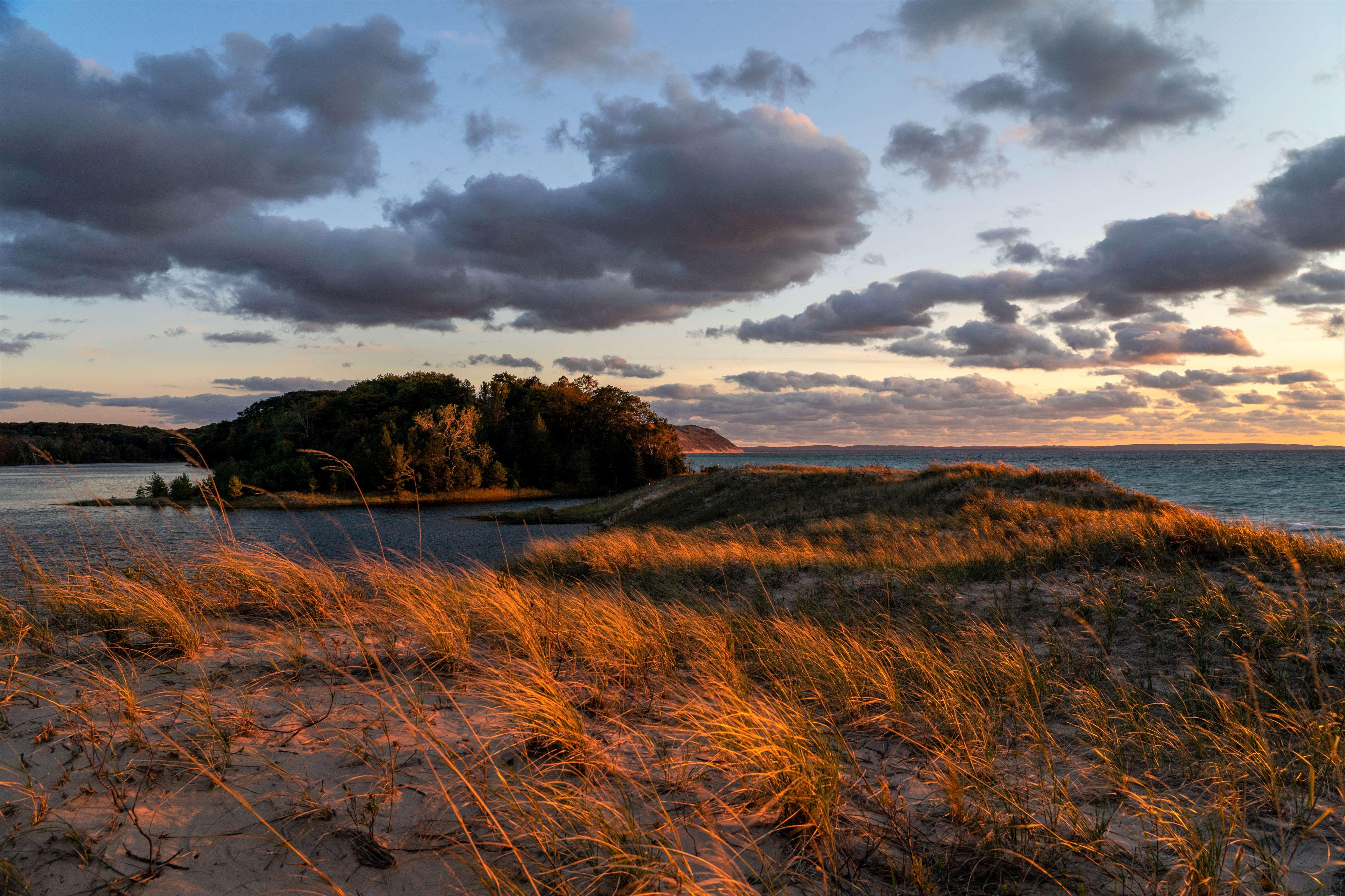 Dunes at sunset surrounded by two lakes