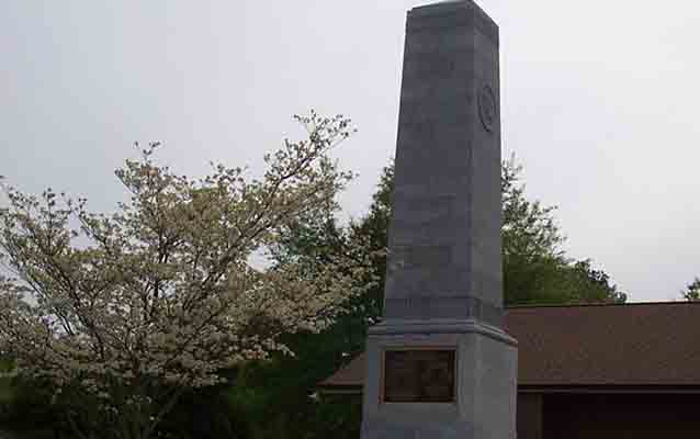 A dogwood tree blooms in front of the US Monument at the Cowpens National Battlefield Visitor Center A dogwood tree blooms in front of the US Monument at the Cowpens National Battlefield Visitor Center