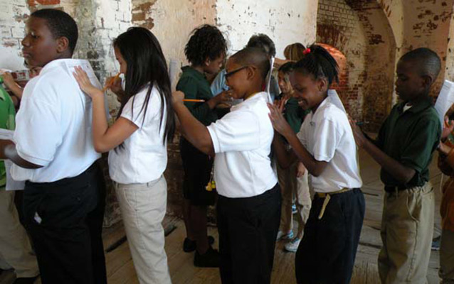 Students working together at the fort. Students working together at the fort.