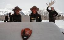 Rangers sitting at a desk made of snow