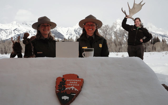 Rangers sitting at a desk made of snow