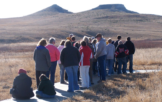 Volunteer hiking with a school field trip on the Fossil Hills trail.