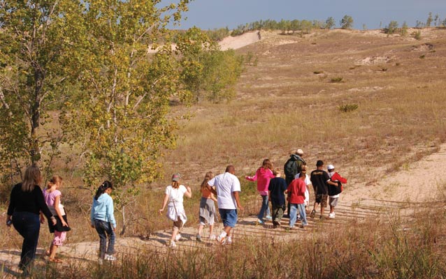 Ranger leads walk on dune