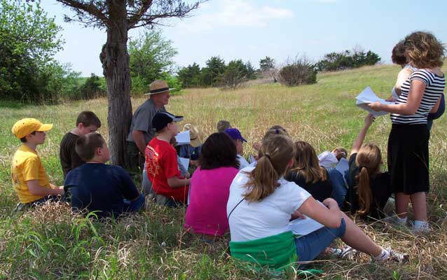Kids learning about the importance of fire to the prairie
