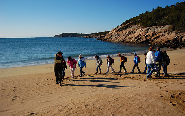 A class explores the geology and wonder of Sand Beach.