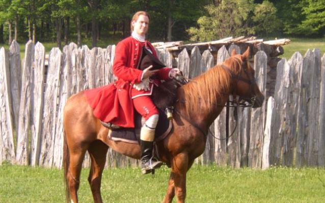 Washington on a horse in front of Fort Necessity