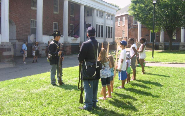 Kids learn about the life of a soldier in historic Fort Jay!