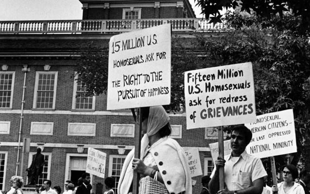 Black and white photo from 1967 showing a group of picketers in front of Independence Hall with signs calling for civil rights for LGBT people. Black and white photo from 1967 showing a group of picketers in front of Independence Hall with signs calling for civil rights for LGBT people.
