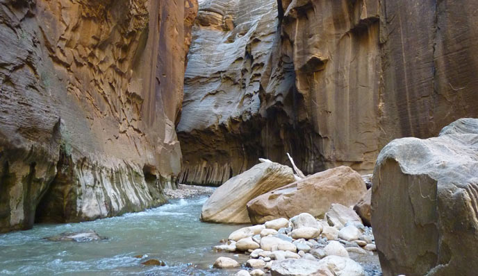 river flowing between narrow canyon walls river flowing between narrow canyon walls
