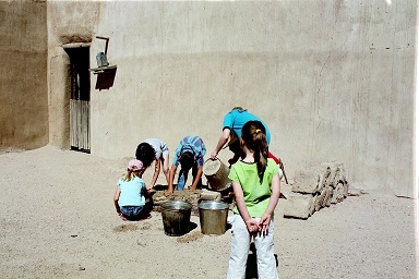 Children working with adobe