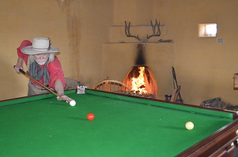 Man playing on billiard table