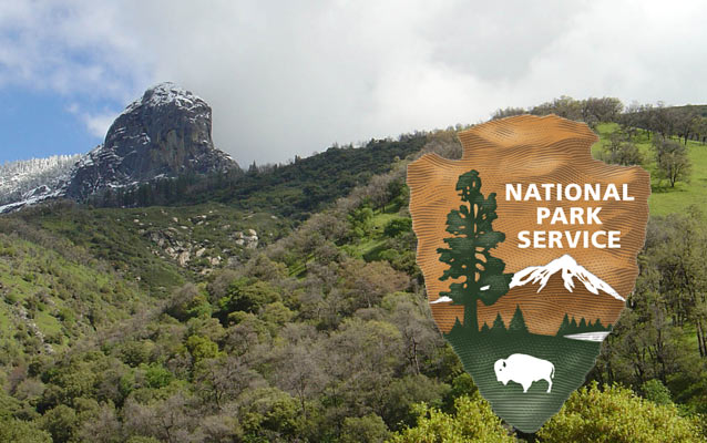 The NPS Arrowhead in front of Moro Rock at Sequoia National Park.