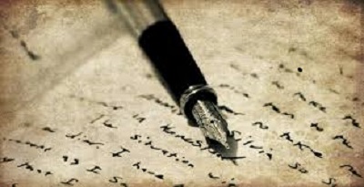 Ink pen lays on top of paper with manuscript writing Ink pen lays on top of paper with manuscript writing