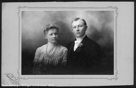 J.W. Nara and his wife Mary Piehl pose for a wedding portrait in formal attire J.W. Nara and his wife Mary Piehl pose for a wedding portrait in formal attire