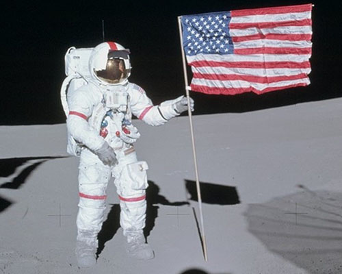 astronaut holding a flag astronaut holding a flag