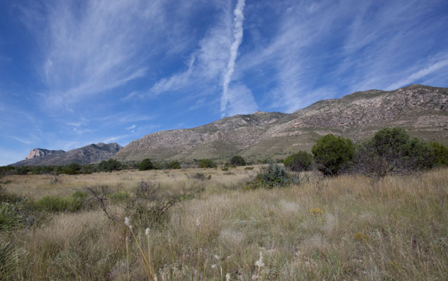 The Frijole Ridge, part of the Capitan Reef, rises above the dry landscape. NPS photo