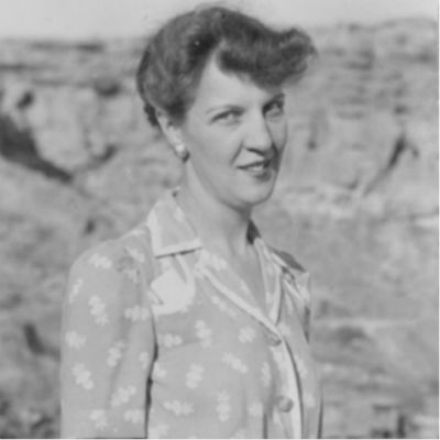 black and white photo of a woman standing in a desert environment black and white photo of a woman standing in a desert environment