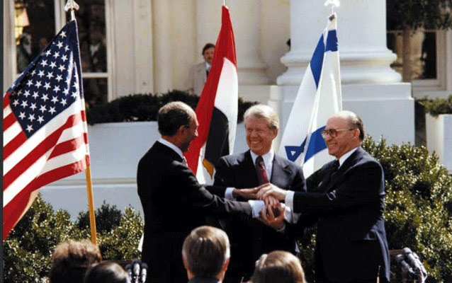President Carter, President Sadat, and Prime Minister Begin celebrate Camp David Accords. www.cartercenter.org
