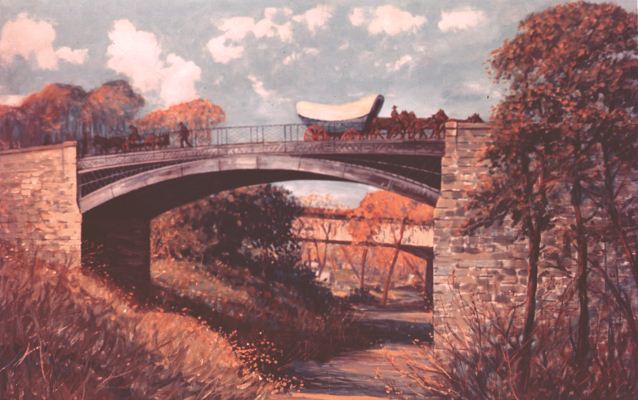Illustration of a Conestoga wagon crossing a bridge