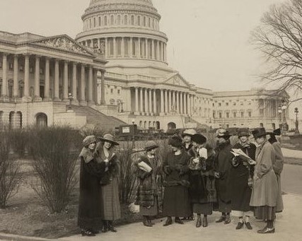 Group of National Woman's Party members assembled in front of the United States Capitol.