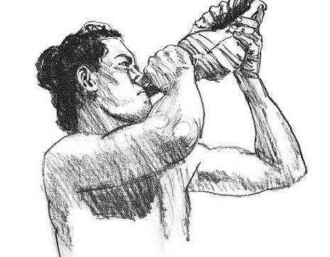 Hawaiian Man blowing a Conch Shell Hawaiian Man blowing a Conch Shell