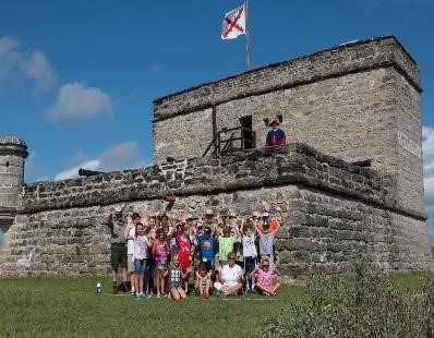 Group of students in front of the fort. 