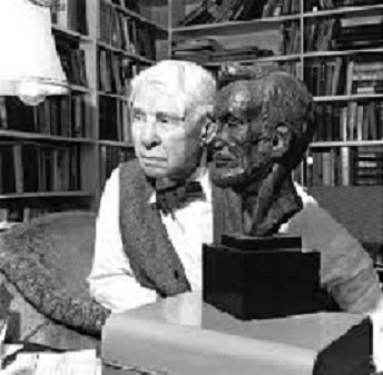 Black and White photo of Carl Sandburg with a sculpture bust of Abraham Lincoln